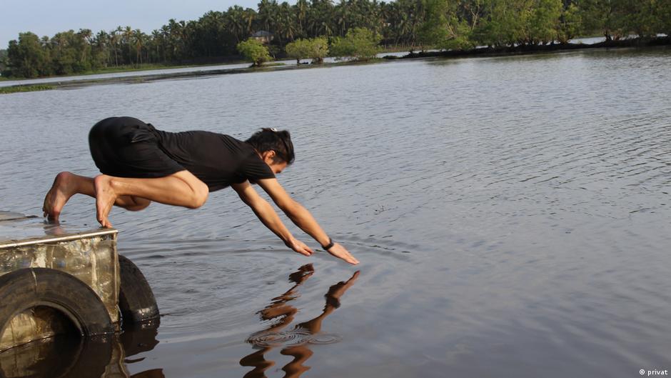 Nematullah's picture showing him jumping in the water. this picture is used in an article by Deutsche Welle