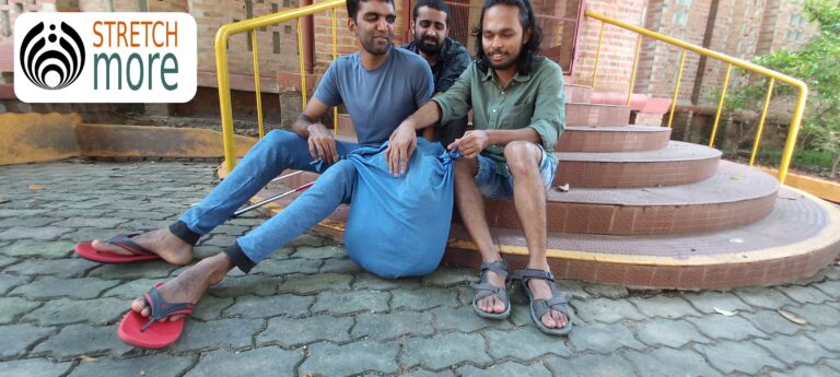 From left: Nibin, Nidheesh and Afsal. They are holding a mannequin for CPR practice that we made during the training. All three are sitting on a steps in front of a building
